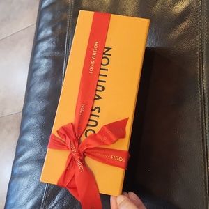 Louis Vuitton rectangle magnetic box with tissue and ribbon.